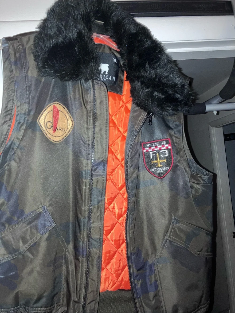 American Stitch Men's Camo Bomber Vest with Orange Lining and Black Fur Collar